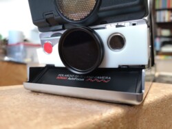 Polaroid SX-70 Adapter The filter adapter complete with 32/37mm Step Up ring and 37mm ND4 Filter.